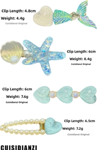 Detailed view of translucent macaron heart and shell hair clips with pearl accents