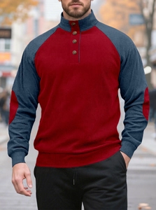 Detail of red and navy raglan sleeves with textured ribbed knit and buttoned collar