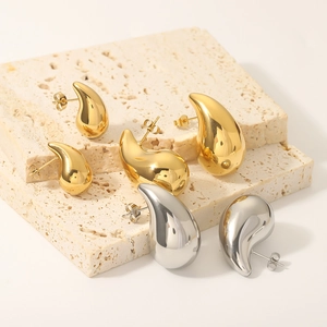 Polished hollow water drop earrings in 18K gold and silver finishes on stone bases