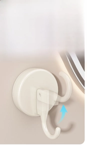 Macro detail of creamy white suction cup hook showing easy-release removal mechanism