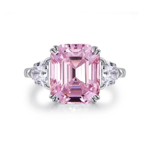 Sparkling emerald-cut pink zircon ring with trillion side stones on a minimalist band