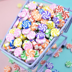 Colorful spiral mini candy accessories displayed in a purple toy shopping cart for DIY crafts