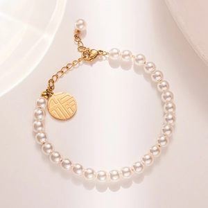 Elegant 18K gold lucky charm pearl bracelet with round Fu pendant for women