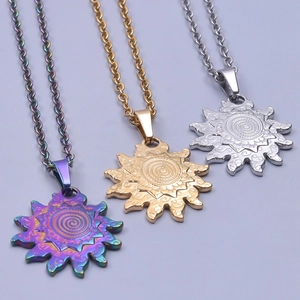 Detail of sunburst pendants with spiral texture in gold, silver, and iridescent finishes