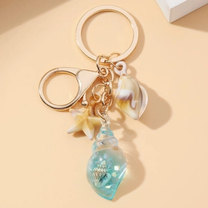 Luminous conch and starfish keychain with blue resin shell charm on gold ring