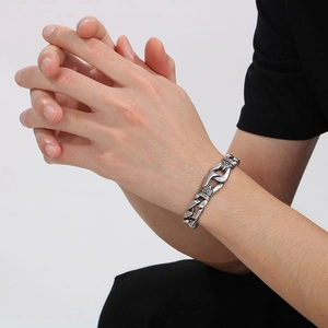 Vintage stainless steel totem chain bracelet for men with retro silver finish on model
