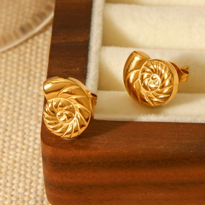 Elegant 18K gold stainless steel nautilus shell stud earrings on jewelry box