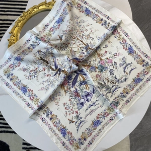 70cm satin silk square scarf with blue peony and bird patterns on a white table
