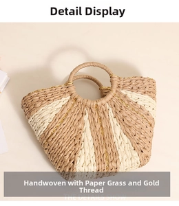 Close-up of handmade straw tote bag featuring golden thread weave and round handles