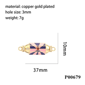 Detail of copper gold plated enamel evil eye connector with red heart gem for DIY jewelry