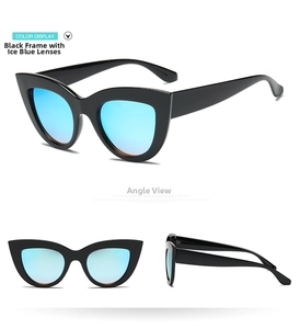 Detail view of retro cat eye sunglasses with black frames and ice blue mirrored lenses