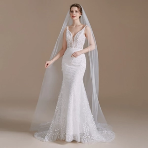 Elegant white mermaid wedding dress with deep V-neck, lace embroidery and long tulle veil