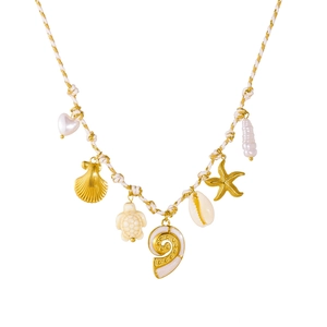 Bohemian white woven rope necklace with gold ocean pendants and pearls on white background