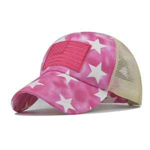 Close-up of pink star pattern and breathable mesh on a distressed ponytail baseball cap