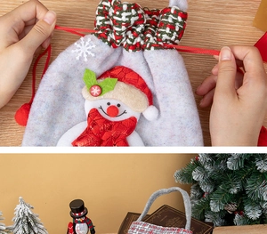 Detail of Christmas felt gift bag with drawstring closure and snowman patch embroidery