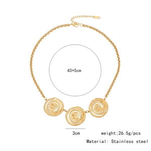 Detail of golden stainless steel necklace with three hollow rose floral pendants
