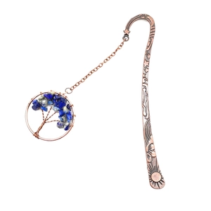 Detail of vintage bronze bookmark with tree of life pendant and blue crystal stones