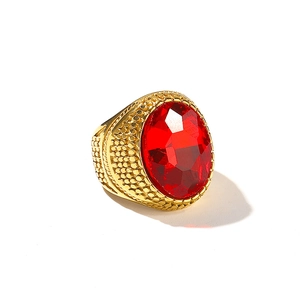 Retro hip hop style gold plated ring featuring a large oval red gemstone and relief texture