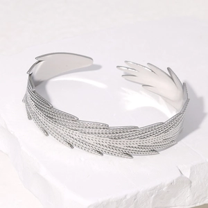 Minimalist silver stainless steel open feather bangle with detailed textured engraving