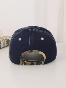 Detail of adjustable back strap and camouflage stitching on navy baseball cap
