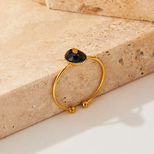 Elegant gold-plated stainless steel open bangle with faceted black faux onyx stones