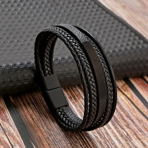 Detail of multi-layer black braided leather bracelet for men with magnetic metal clasp