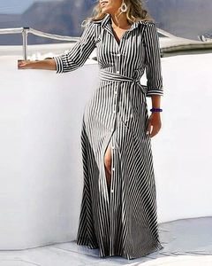 Elegant long-sleeved shirt dress featuring classic black and white vertical stripes