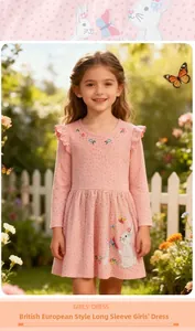 Detail of pink long-sleeved girl dress with rabbit embroidery and ruffled shoulders