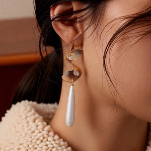 Vintage gold twisted earring with zircon crystals and elegant white waterdrop pendant