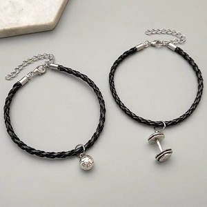 Black braided leather bracelets featuring silver soccer and dumbbell charms for men
