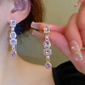 Vintage gold drop earrings with purple gemstones and micro-set cubic zirconia accents