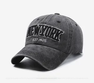 Detail view of New York embroidery on washed charcoal grey vintage cotton baseball cap