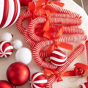 Red and white Christmas candy cane ornaments set with knitted texture for tree decor