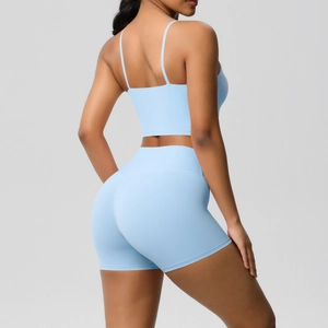 Detail of baby blue yoga set showing the criss-cross back and high-waist fitness shorts