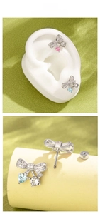 Macro view of bow-knot earrings with heart gemstones and secure screw-back needles