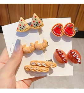 Detailed close-up of 5-piece funny food resin hair clips with pizza and bread shapes