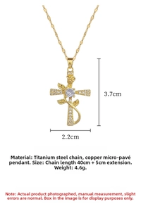 Detailed macro view of a gold cross pendant with rose motif and zircon stone on titanium steel