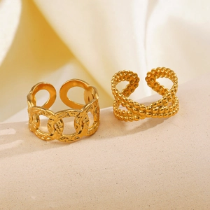 Two-piece gold stainless steel ring set featuring hammered chain and beaded cross designs