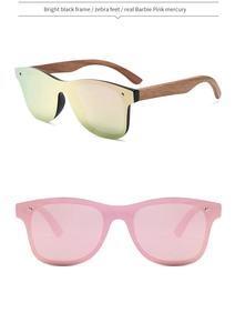 Detail of bamboo sunglasses with bright black frame and pink mercury lenses