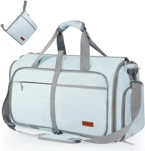 Light blue large travel duffel bag with grey handles shown unfolded and folded into a pouch