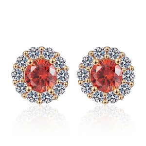 Boucles d'oreilles or champagne avec pierre rouge centrale et halo de zircons blancs