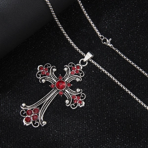 Hip hop style silver stainless steel cross necklace featuring vibrant red crystal accents