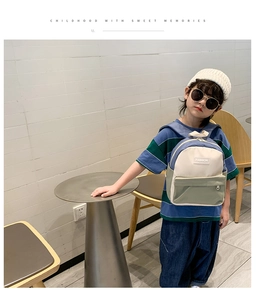 Kids color-block canvas backpack featuring Fashion label and adjustable straps shown on back