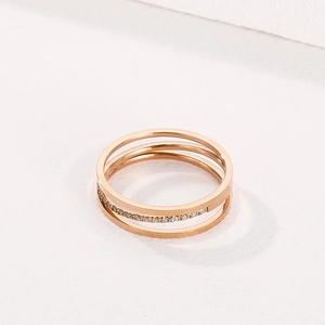 Close-up of three-layer rose gold titanium steel ring with micro-pave cubic zirconia
