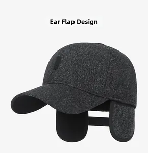 Detail of warm winter baseball cap with ear flaps extended showing grey textured wool fabric