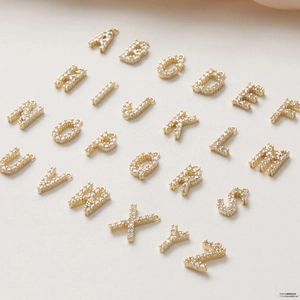 Detailed collection of 26 gold-plated alphabet pendants with zircon inlay for jewelry DIY