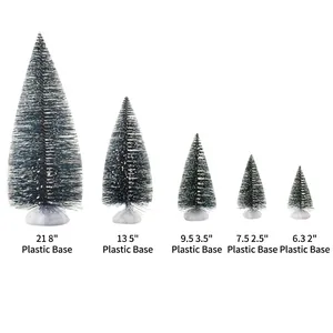 Five assorted miniature frosted Christmas trees with white snow tips and plastic bases