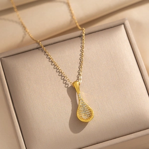 Tennis racket pendant necklace in gold finish with sparkling pavé zircons in jewelry box