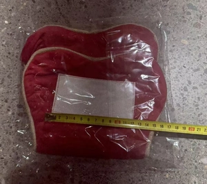 Detailed measurement of red heart Christmas stocking bone showing 20cm width with tape measure
