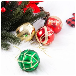 Detailed view of assorted 6cm glitter Christmas balls with festive patterns on white fur